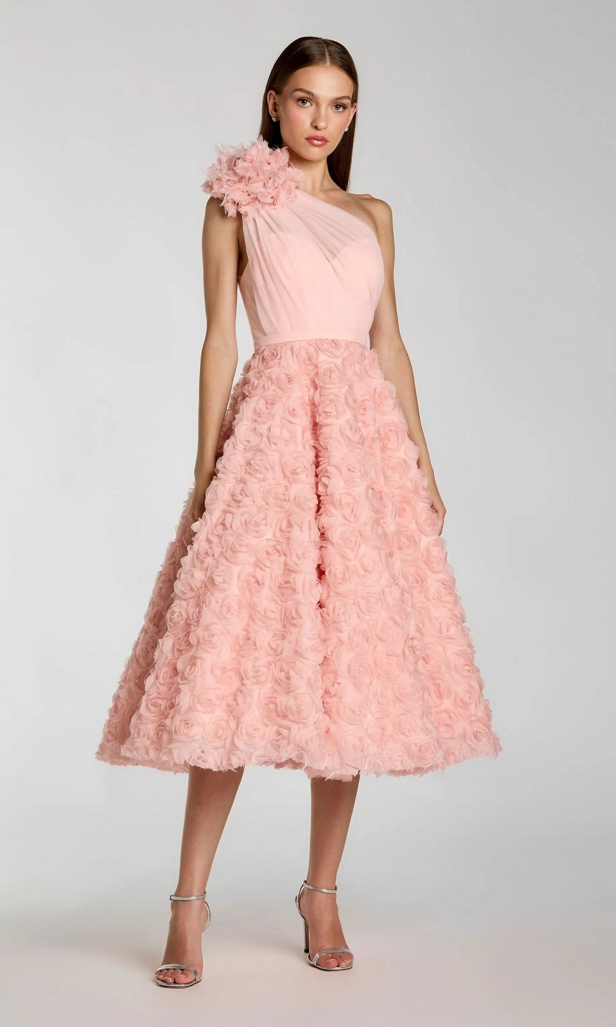 Woman wearing the Midi Wine Wedding Guest Dress: Mac Duggal 27698—an elegant one-shoulder dress adorned with a floral appliqué and a textured, rosette-patterned skirt, putting a sophisticated spin on the ruffled party classic.